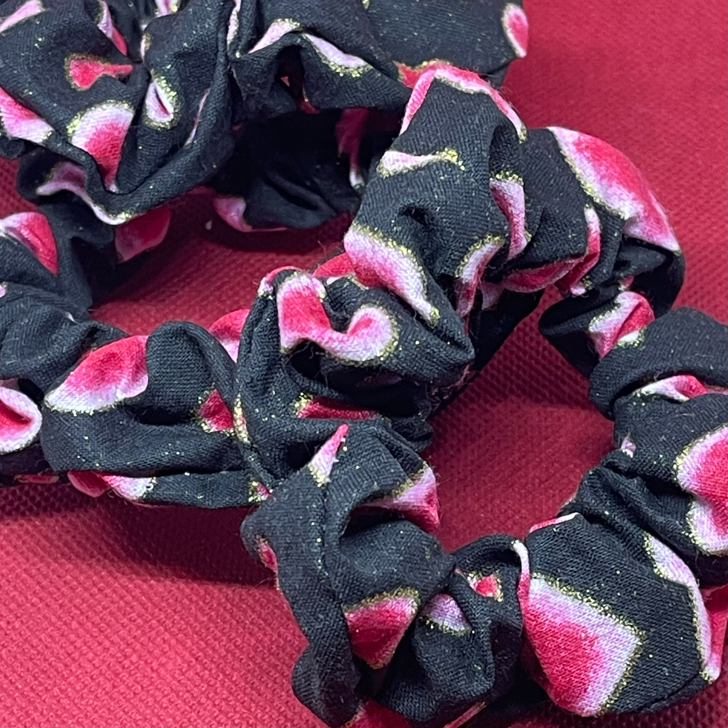 Skinny black scrunchie with pink hearts