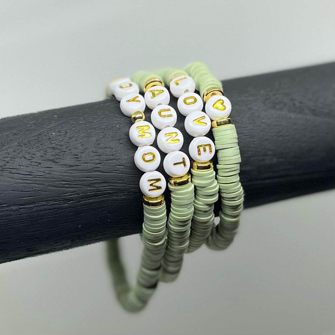 bracelet stack in sage green with custom words