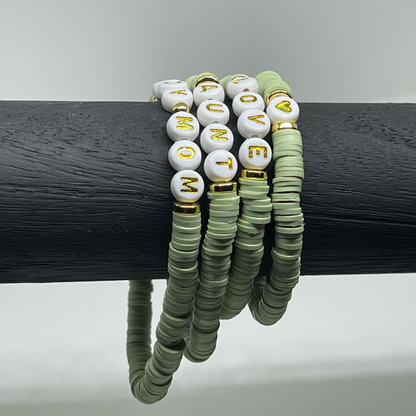 Set of beaded bracelets with 'LOVE' and 'MOM' and other customizable words with gold accents
