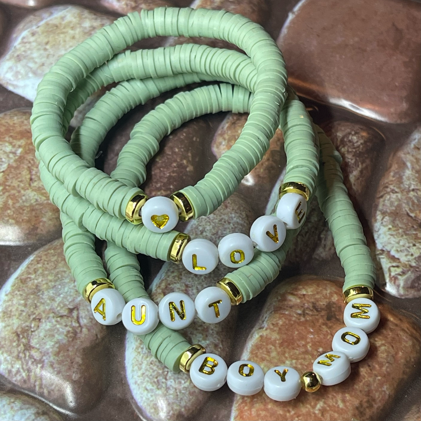 green bracelets with words mom love heart and aunt