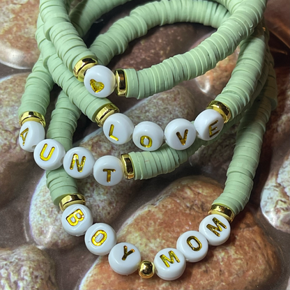 sage green bracelets with custom gold name bracelet